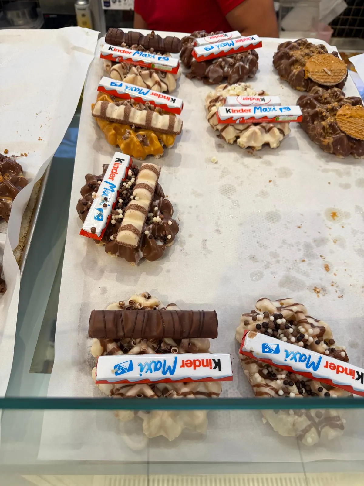 Waffles and pastries topped with Kinder chocolate bars
