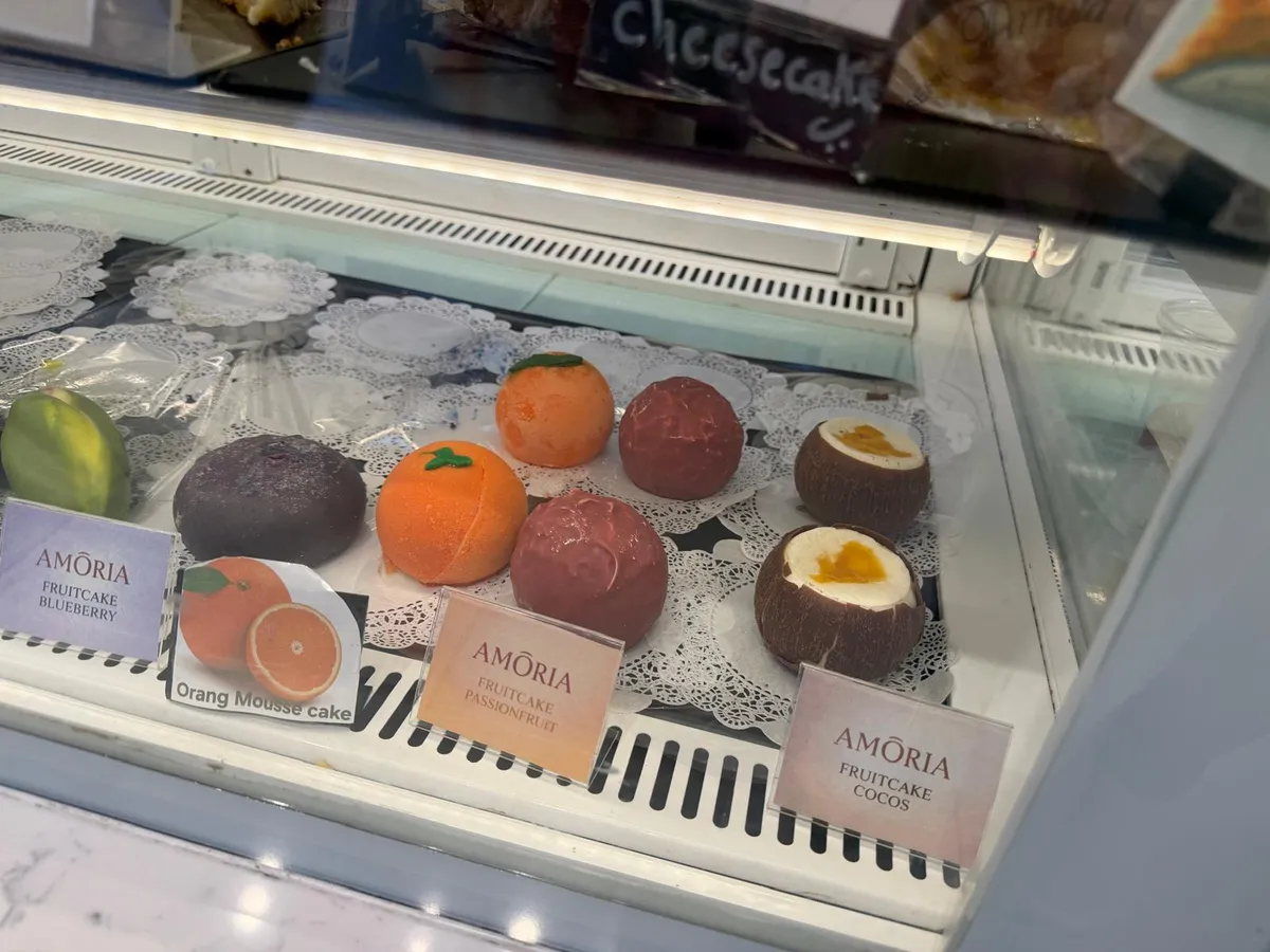 Mousse cakes in the chilled case: blueberry, orange, raspberry and cocoa